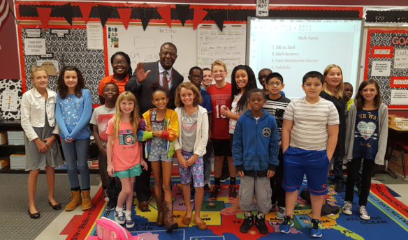 Thomas Woods-Tucker, center, a former superintendent of Douglas County Schools in Colorado, visits a classroom of students in his former district.