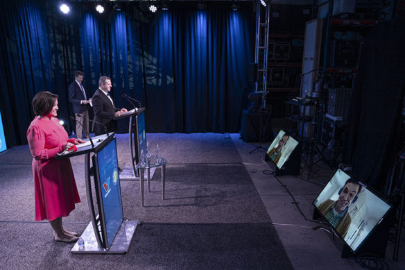 Lt. Gov. Jacqueline Coleman, Education Commissioner Jason E. Glass and Valvoline CEO Sam Mitchell congratulate 2021 Kentucky Teacher of the Year Donnie Piercey, on a monitor.