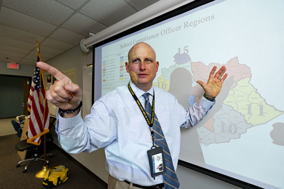 Ben Wilcox, Kentucky’s first state school security marshal, speaks at the Kentucky Department of Criminal Justice Training during September in front of a map showing the districts his 16 compliance officers cover.