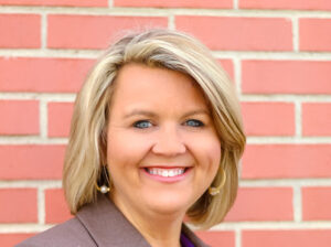 Headshot photo of a woman smiling. 