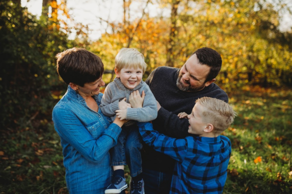 A photo of a family laughing together. 