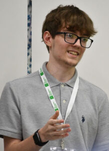 A boy smiling while talking.