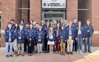 A group picture of STAR students with Lt. Gov. Jacqueline Coleman in front of the Challenger Learning Center.
