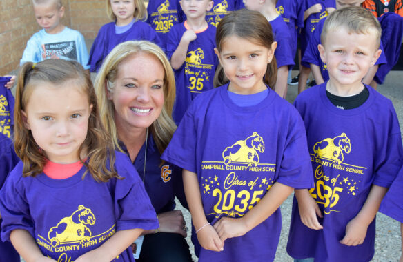 Shelli Wilson smiles with students. 