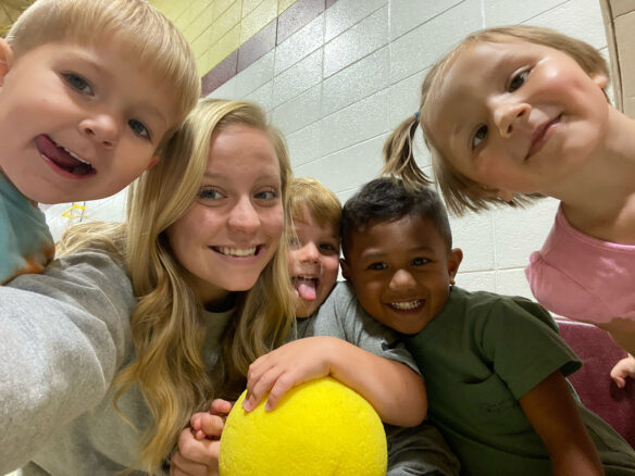 Carlisle County preschool students and a high school Carlisle PALs participant smile for a selfie photo. 