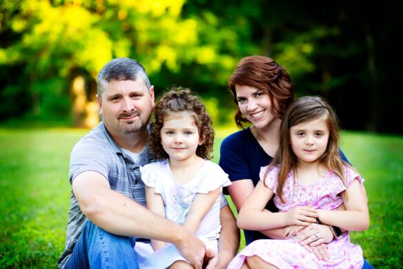 James Cornett with his wife and two daughters.