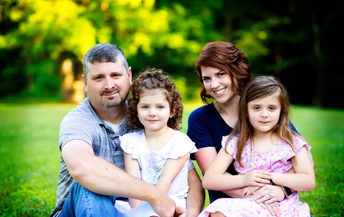 James Cornett with his wife and two daughters.