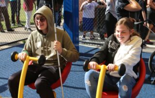 Students from the Kentucky School for the Blind play on the playground.