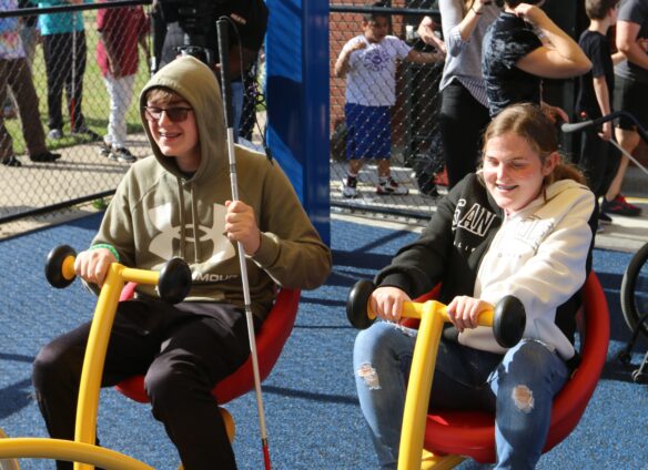 Students from the Kentucky School for the Blind play on the playground.