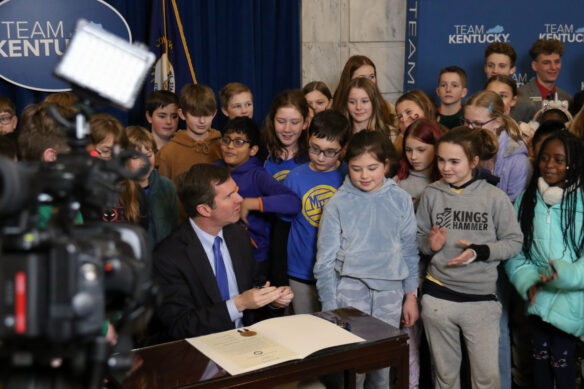 Governor Andy Beshear after he signed a proclamation commemorating Gifted Education Month with a group of kids