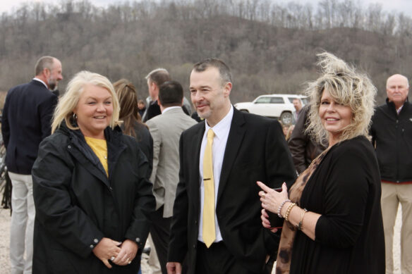 A picture of Monica Daniel, Sean Cochren and Valerie Blair standing outside on a windy day.