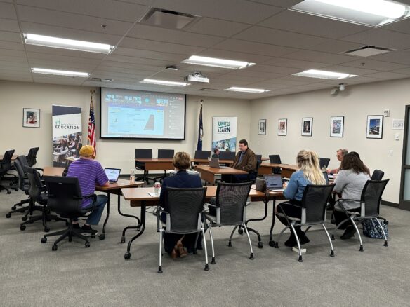 Picture of members of KDE's Teachers Advisory Council sitting around tables during a meeting.