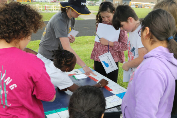 A photo of students gathered around a table