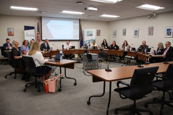 Kentucky Board of Education members talk during a meeting.