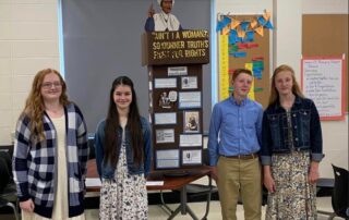Rayawna Holland, Rylee Fuson, Sawyer Frye and Savannah Frye are standing in front of their history project entitled Ain’t I a Woman?: Sojourner Truth’s Fight for Rights