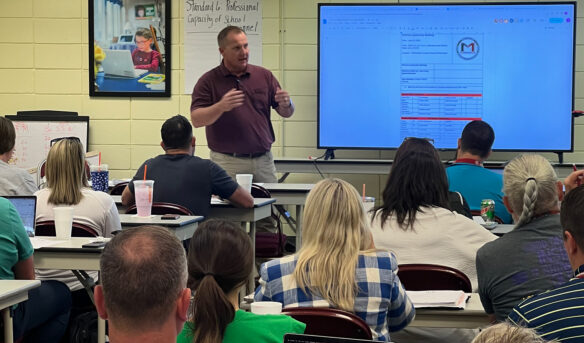 Josh Hunt speaks to a classroom of students