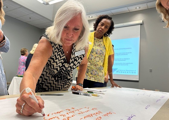 Picture of two female Kentucky Board of Education members during the Aug. 2 meeting. 