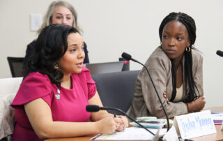 India Young and Honette Irakiza talk during the Commissioner's Student Advisory Council meeting