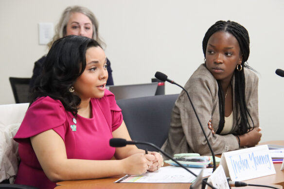 India Young and Honette Irakiza talk during the Commissioner's Student Advisory Council meeting