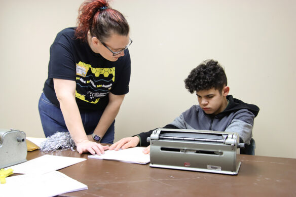 A woman talks to a student