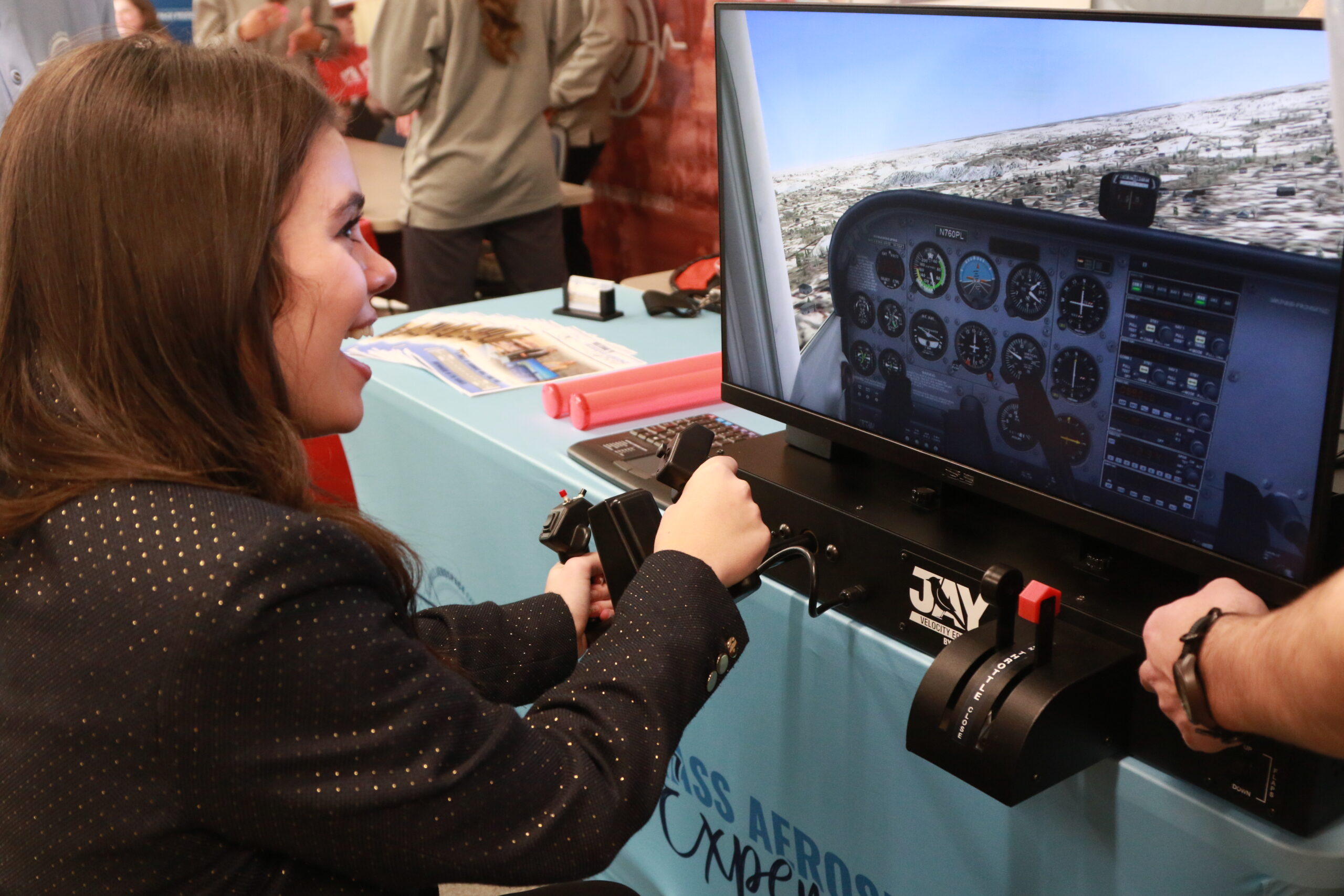one girl playing on an interactive flight simulator