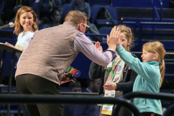 Marty Park high fives a student