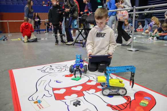 A child plays with robots on an Operation-like game
