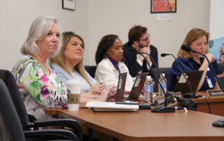 Patrice McCrary, Alissa Riley, Diana Woods and Holly Bloodworth listen during a presentation