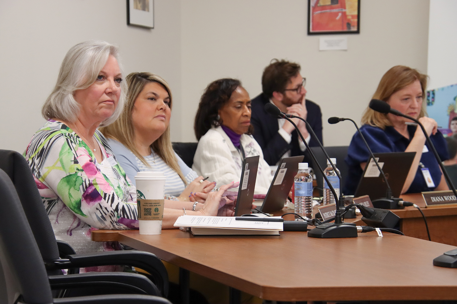 Patrice McCrary, Alissa Riley, Diana Woods and Holly Bloodworth listen during a presentation