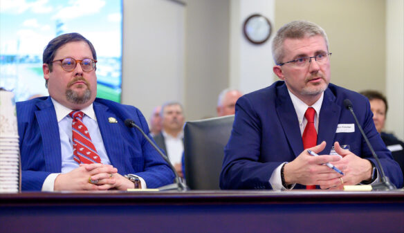 Phillip Wheeler and Robbie Fletcher sit at a table