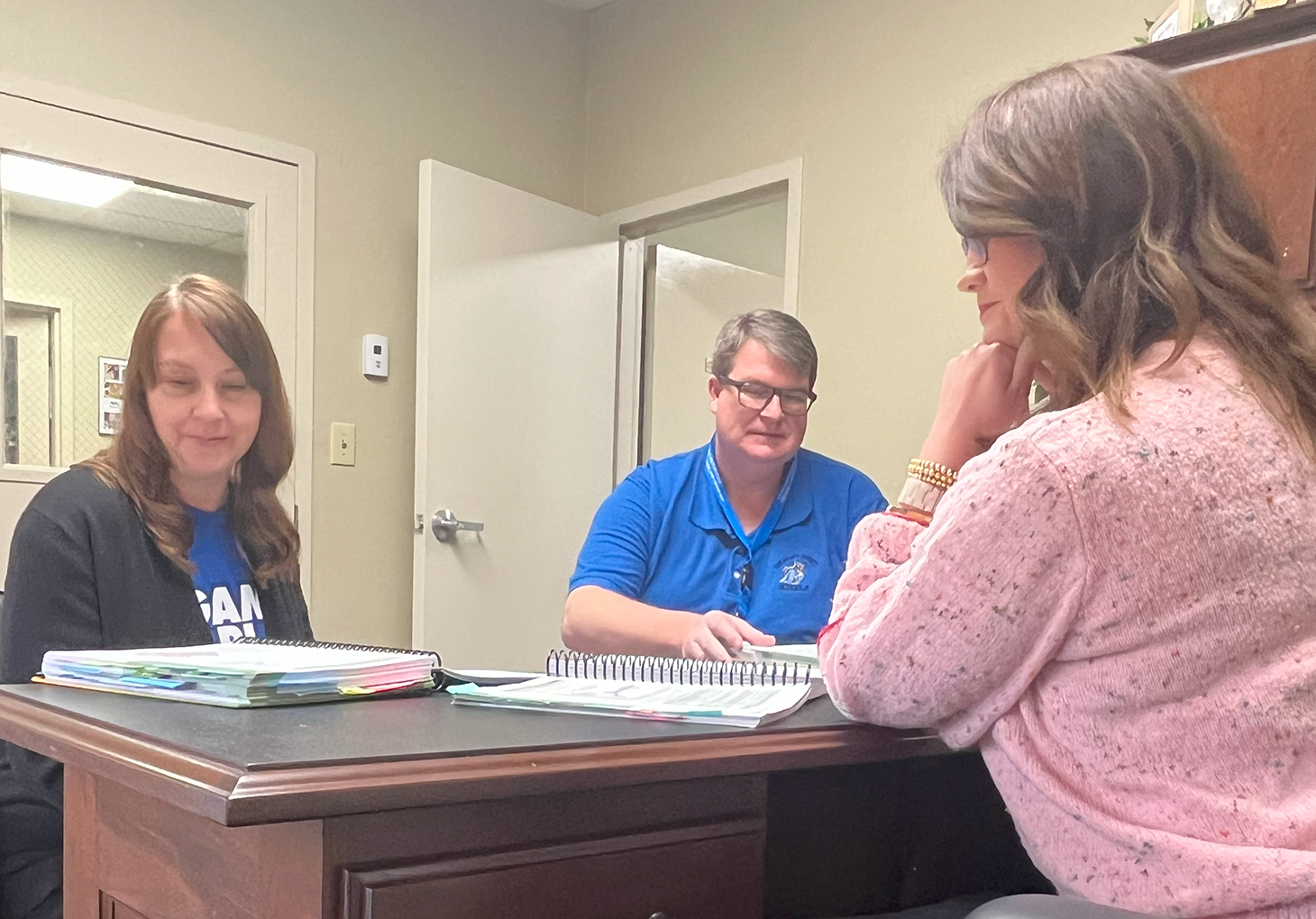 Breathitt County District Literacy Specialist Fannie Hall studies the LETRS for Administrators manual with Chief Academic Officer Timothy Wooton and Curriculum Specialist Nancy Eversole. Submitted photo.