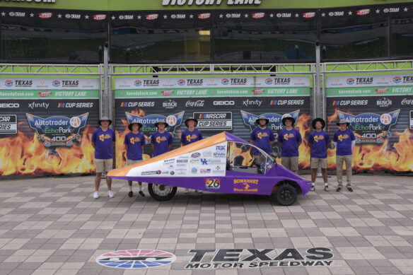 Members of the Somerset Solar Jumpers team pose around their car following the 2024 Solar Car Challenge