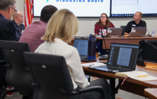 Amber Snell talks to other EPSB board members during a meeting