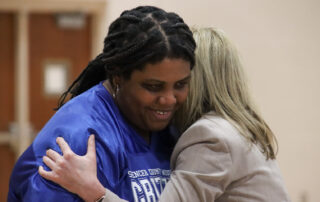 Kala Marshall hugs Erin Demyan.