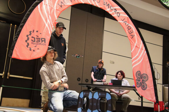 A group of four students compete in a drone challenge