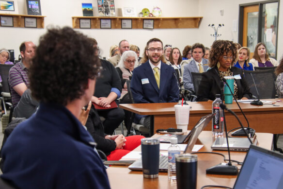 Tyler Saylor, left, an English language arts teacher at Harlan High School (Harlan Independent) and GoTeachKY Ambassador, talks with members of the Education Professional Standards Board about teacher retention. Photo by Joe Ragusa, Kentucky Department of Education, April 21, 2026