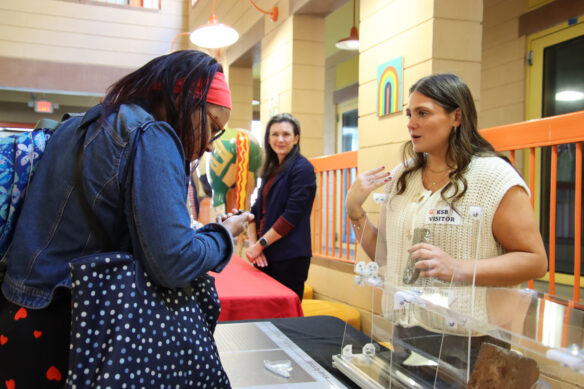 Saylor Fortner, a graduate student with the University of Louisville, explains part of the exhibit the university created with the Kentucky School for the Blind (KSB), exploring the history of the KSB Segregated Department
