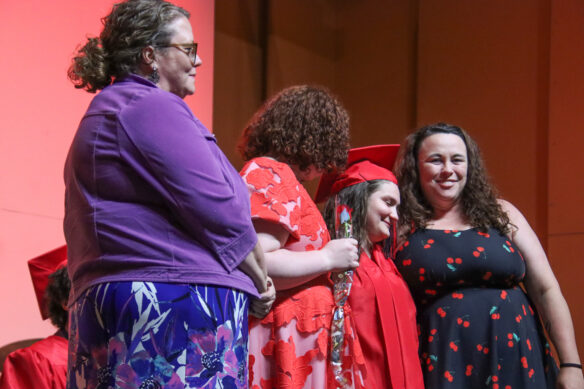 Alexis Salerno poses for a photo on the stage with, from left, KSB staff Beth Baker, Emily Campbell and Jessica Belcher.