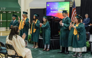 During the commencement ceremony, all six graduates performed a song in American Sign Language called “Dreams We Hold” for the audience. The graduates stand in front of the stage performing the song
