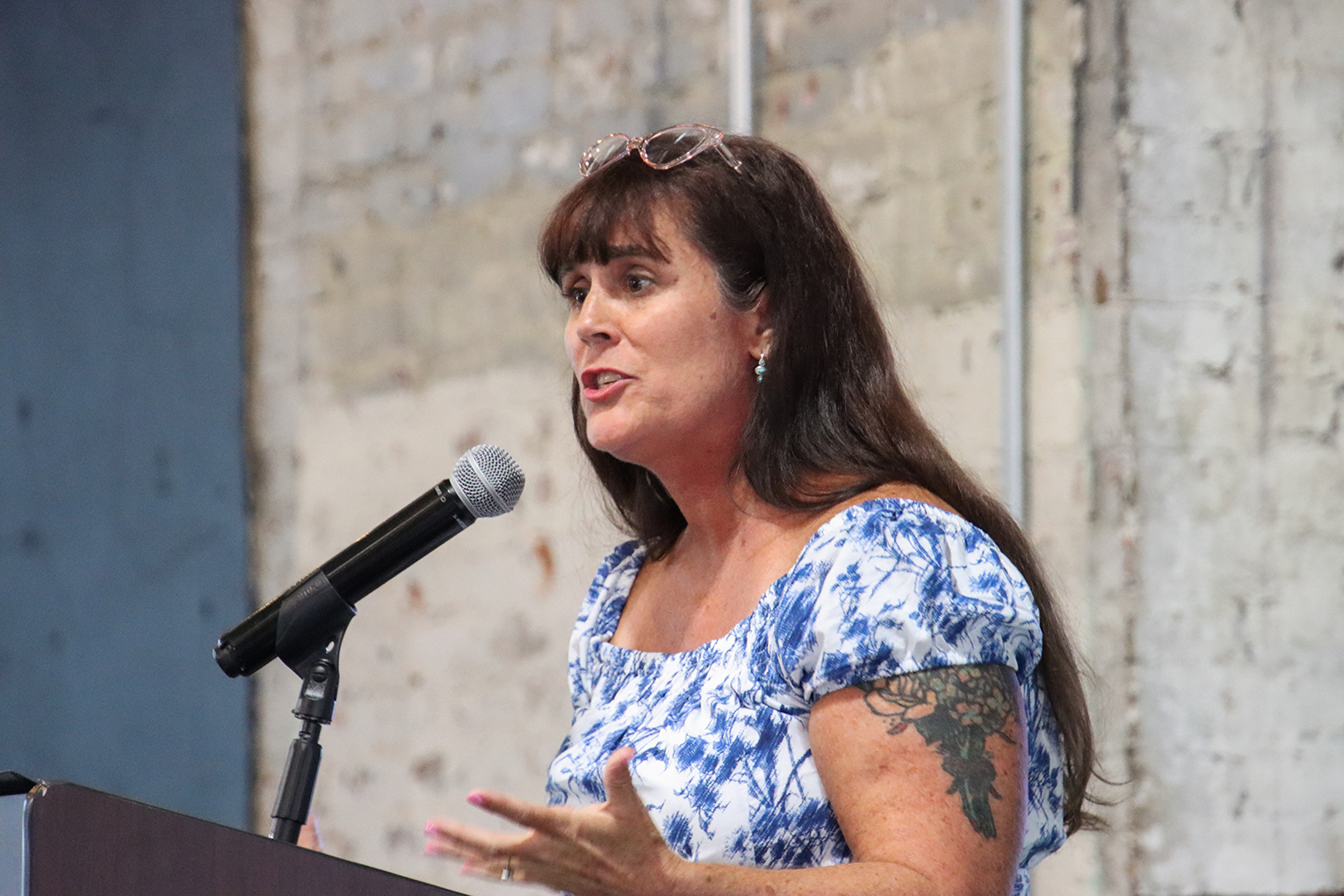 Molly Seifert speaking at a podium after being named the 2027 Kentucky Teacher of the Year.